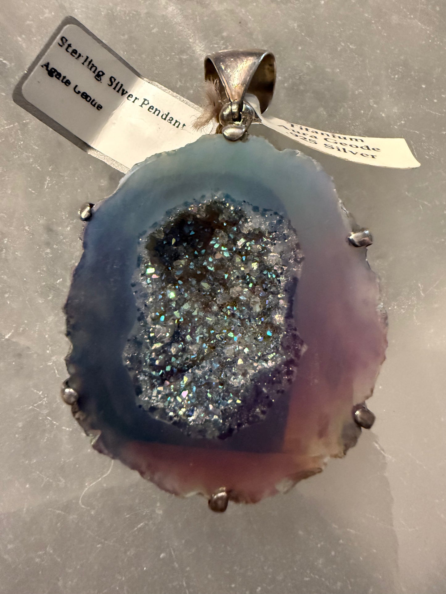 Titanium Aura Crystal Geode Sterling Silver Pendant – unique jewelry piece combining colorful aura and grounding energy.