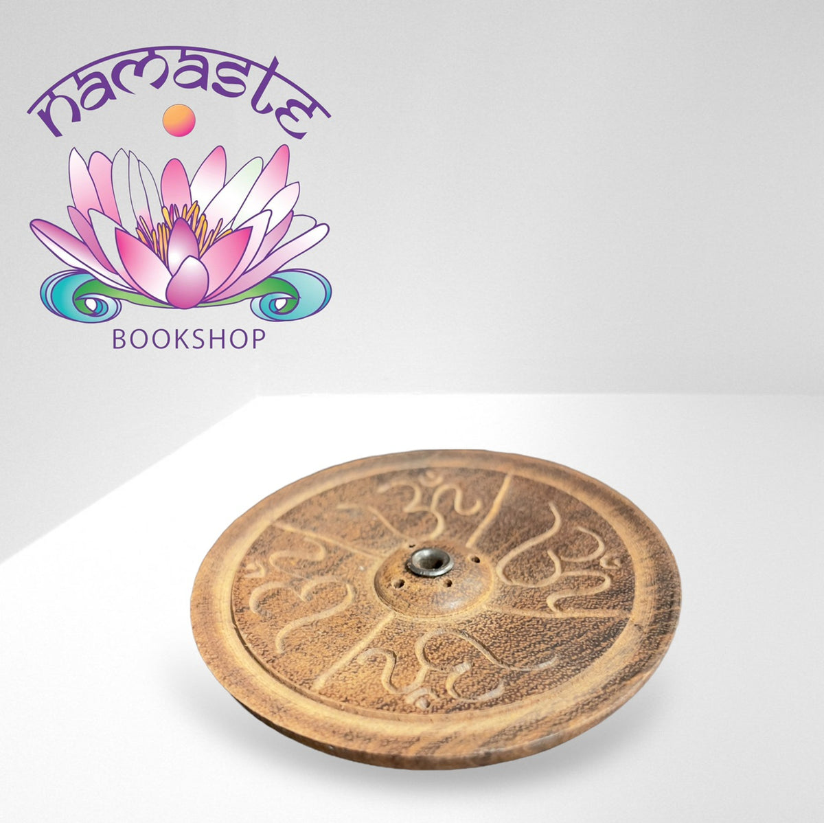 Yoga 'Om' Carved Wooden Incense Burner, incense holder at Namaste Bookshop near Union Square, NYC