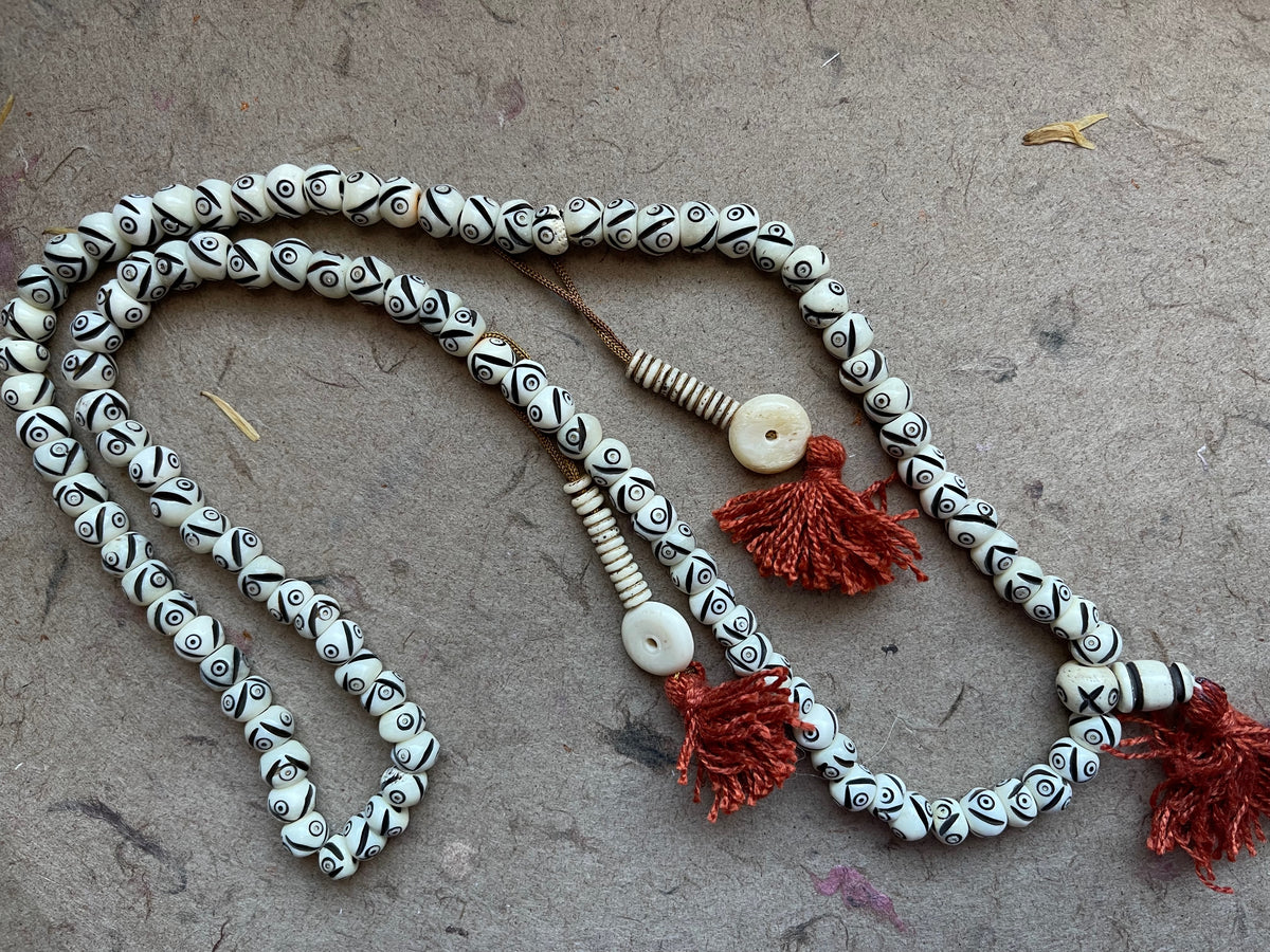 Naga Eye White Bone Carved 108 Rondelle Beads Prayer Mala with Tassel