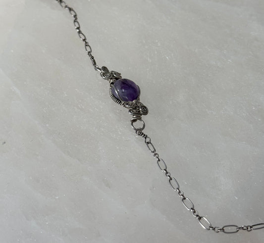Amethyst Sterling Silver Bracelet – rich purple amethyst stones set in sterling silver, perfect for elegant and spiritual jewelry.
