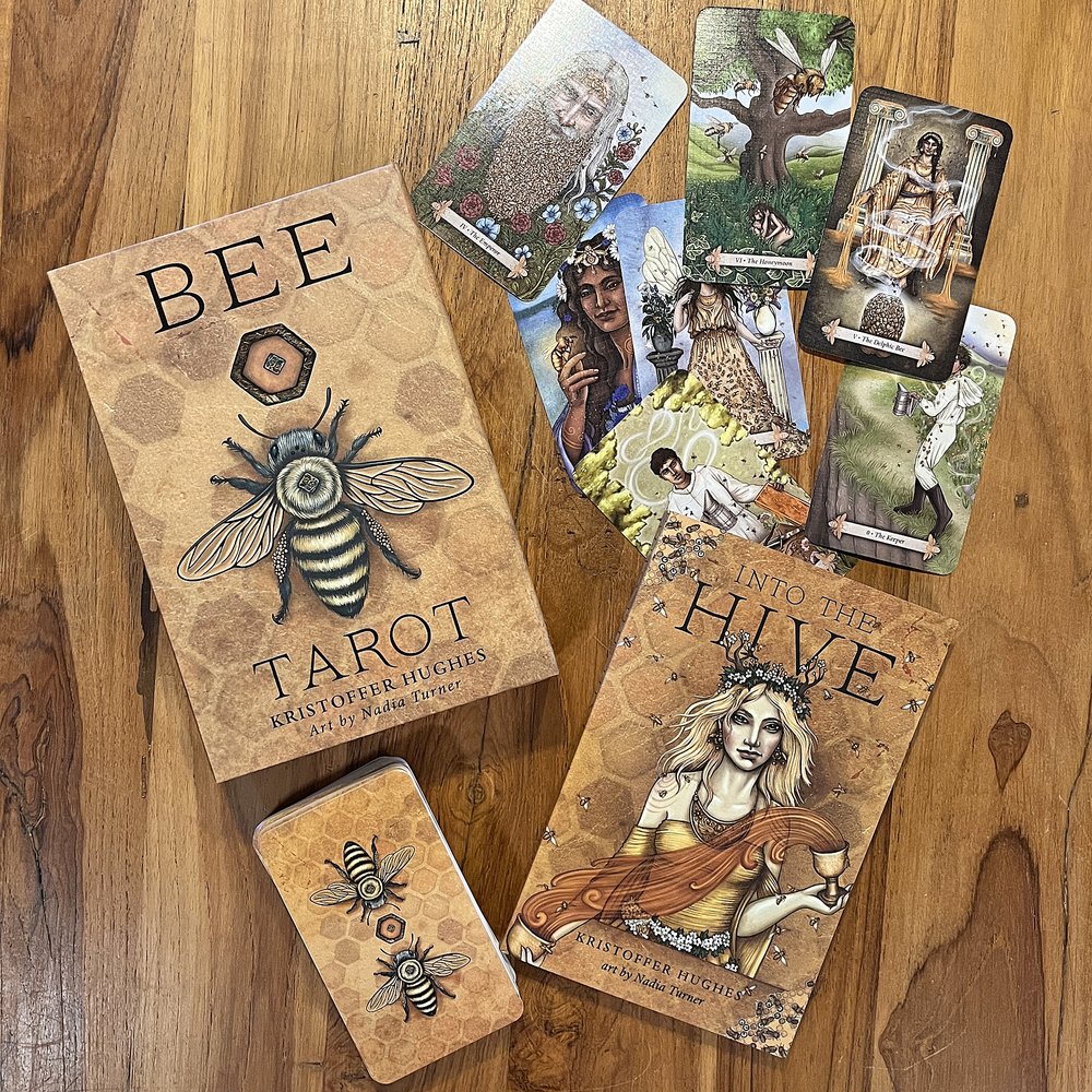 Bee Tarot by Kristoffer Hughes & Nadia Turner – a vibrant tarot deck inspired by bees and nature, highlighting themes of community and growth.
