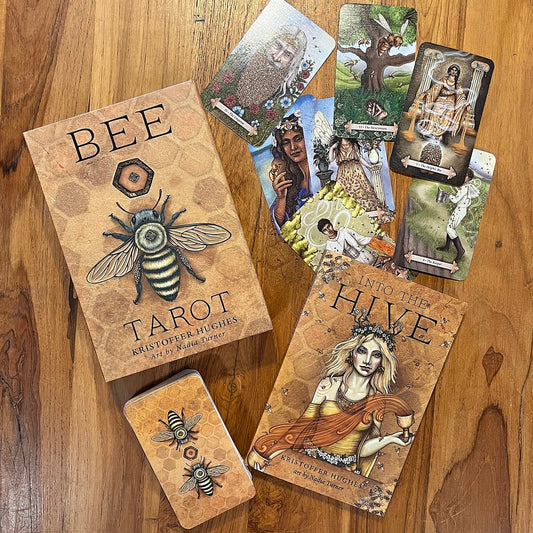 Bee Tarot by Kristoffer Hughes & Nadia Turner – a vibrant tarot deck inspired by bees and nature, highlighting themes of community and growth.

