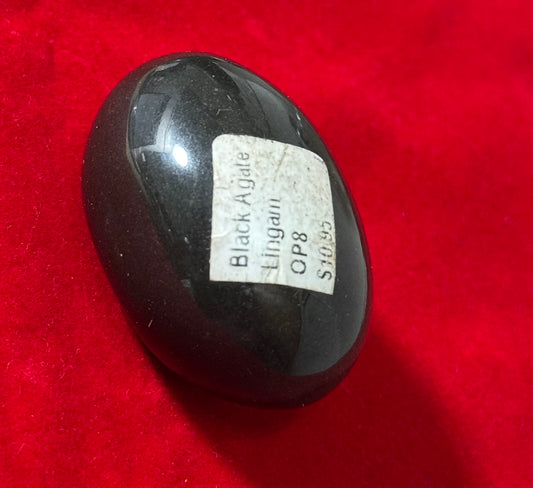 Black Agate Lingam – smooth black agate lingam stone, perfect for spiritual practices and grounding energy.

