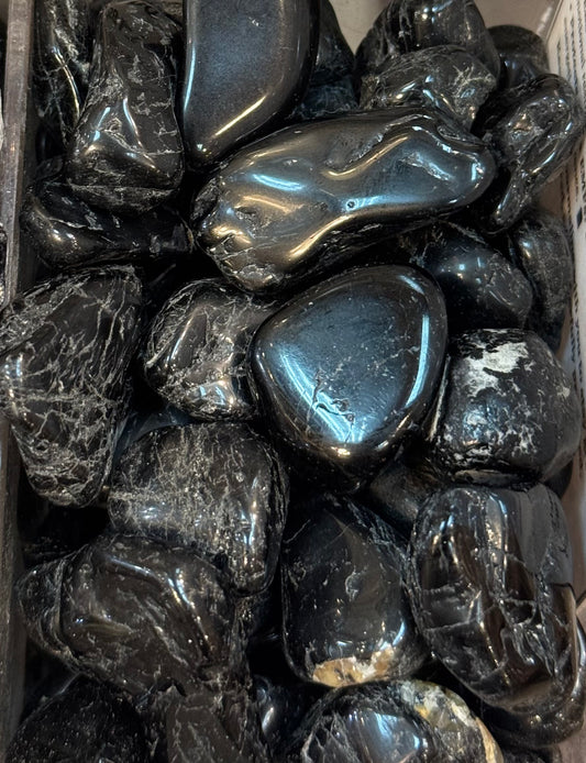 Black Tourmaline Small Crystal Tumbled – polished small black tourmaline stones known for protection and grounding energy.

