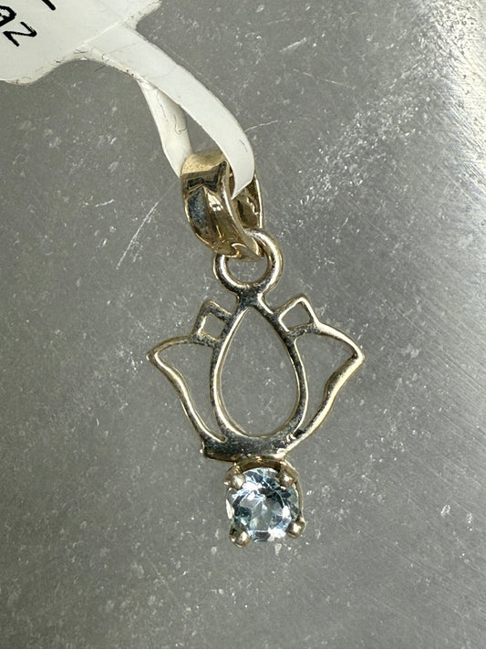 Blue Topaz Sterling Silver Lotus Pendant – radiant blue crystal jewelry featuring lotus design symbolizing clarity, calm, and spiritual awakening.
