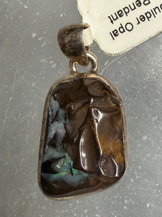 Boulder Opal Sterling Silver Pendant – unique iridescent opal jewelry featuring vibrant colors symbolizing creativity and inspiration.
