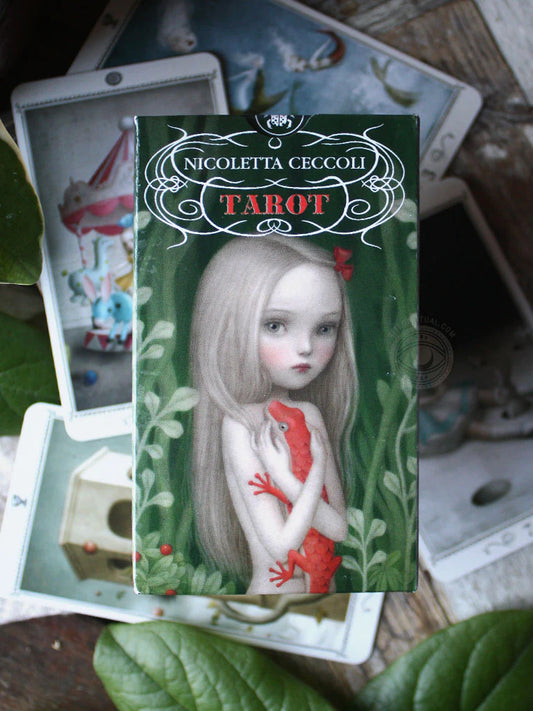 Ceccoli Tarot Deck by Nicoletta Ceccoli – A whimsical 78-card tarot deck filled with surreal, fairy-tale imagery that explores the delicate space between innocence and shadow. Illustrated by Nicoletta Ceccoli and published by Lo Scarabeo.
