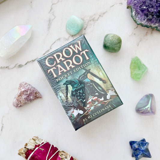 Crow Tarot Pocket Edition by MJ Cullinane – 78-card deck featuring crow and raven symbolism, inspired by the Rider-Waite® Tarot, with a 128-page guidebook including upright and reversed meanings and a custom Crow Tarot Spread.
