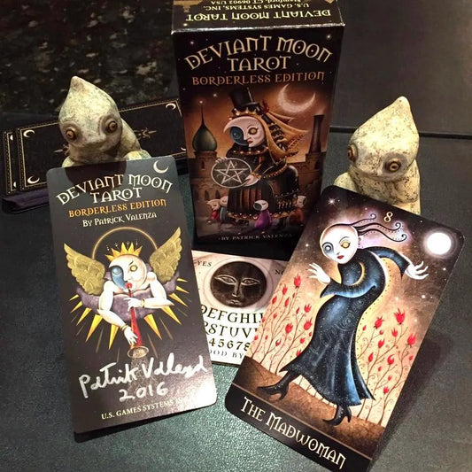 Deviant Moon Tarot Borderless Miniature Edition by Patrick Valenza – a 78-card deck featuring surreal, dreamlike artwork with stylized characters and moonlit dreamscapes, offering deep and evocative tarot imagery.
