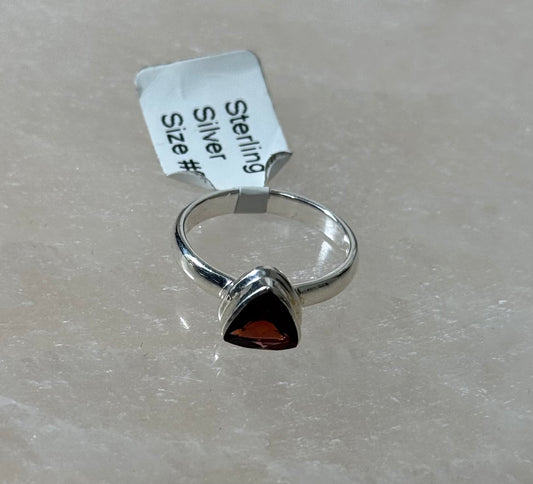 Garnet Faceted Triangle Shaped Sterling Silver Ring Size 6 – beautiful faceted triangle garnet set in sterling silver, ideal for unique and elegant jewelry.
