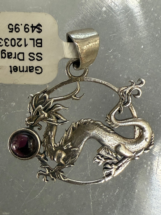 Garnet Sterling Silver Dragon Pendant – bold silver jewelry featuring deep red garnet and dragon design symbolizing strength and protection.
