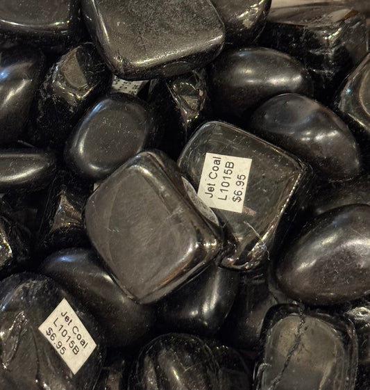 Jet Coal Tumbled Crystal – polished jet coal stones prized for protection and purification.
