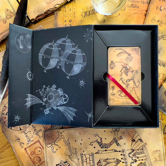 The Lost Code of Tarot Kit by Andrea Aste – 80-card Marseille-style deck with alchemical symbols, accompanied by a 160-page novella exploring the tarot's origins.
