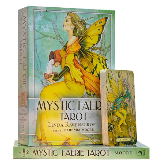 Mystic Faerie Tarot by Barbara Moore & Linda Ravenscroft – enchanting tarot deck featuring watercolor illustrations of faeries, sprites, and nymphs in lush gardens.
