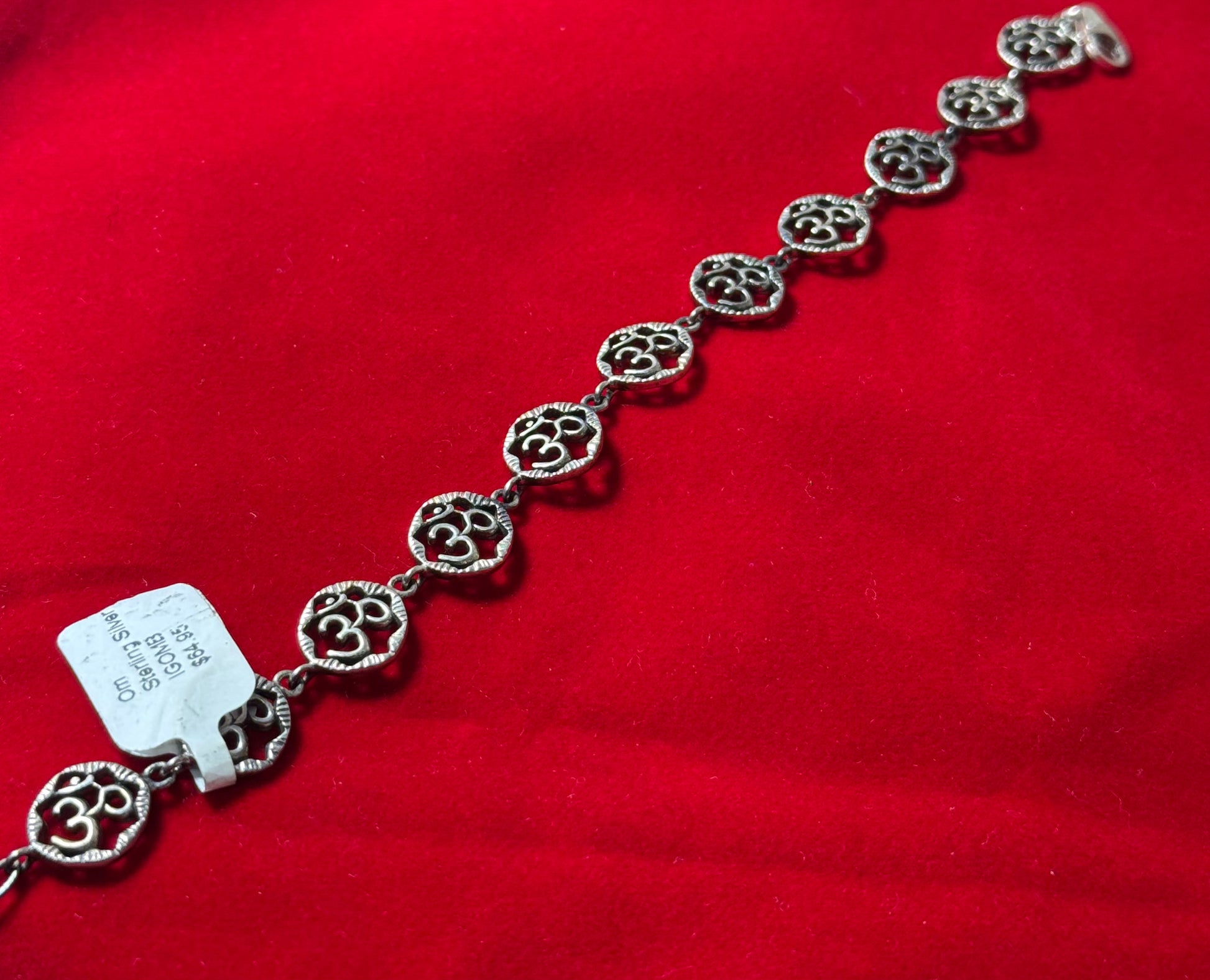 Om Sterling Silver Bracelet – spiritual Om symbol crafted in sterling silver, perfect for meaningful and elegant jewelry.
