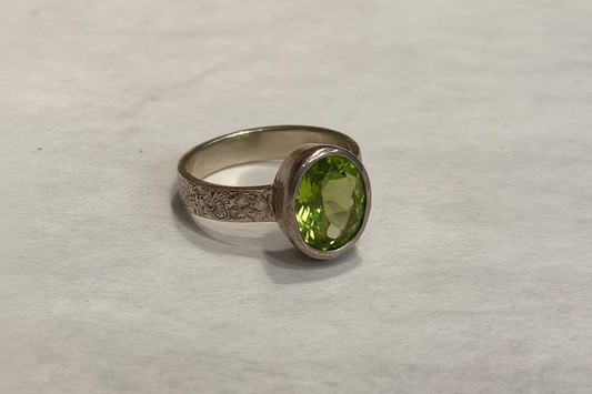 Peridot Sterling Silver Ring size 5 – vibrant green crystal jewelry known for abundance, healing, and positive energy.
