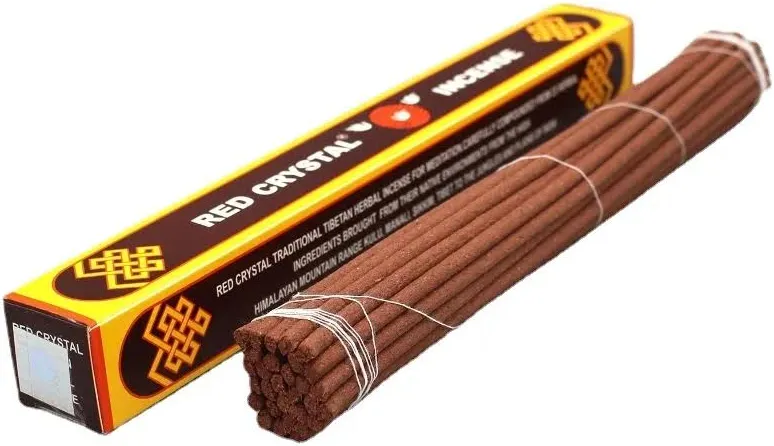 Red Crystal Traditional Tibetan Herbal Incense Sticks alongside red and yellow packaging on white background