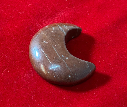 Red Jasper Moon Crystal – deep red jasper carved into a moon shape, perfect for grounding and protective energy.
