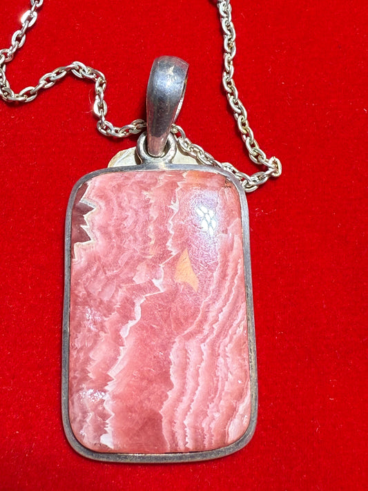 Rhodochrosite A+ Rectangle Sterling Silver Pendant Large – striking rectangular pink crystal jewelry known for emotional healing and love energy.
