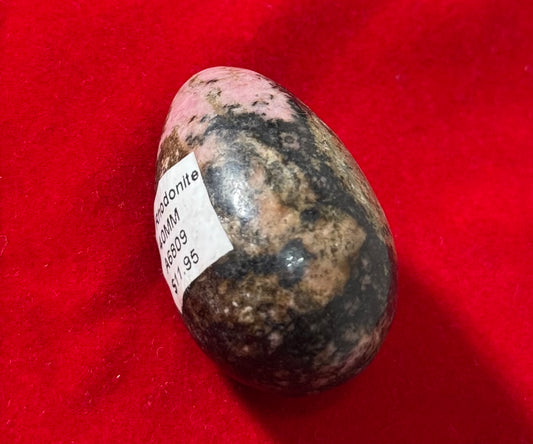 Rhodonite 40MM Crystal – polished rhodonite stone measuring 40mm, known for emotional healing and balance.
