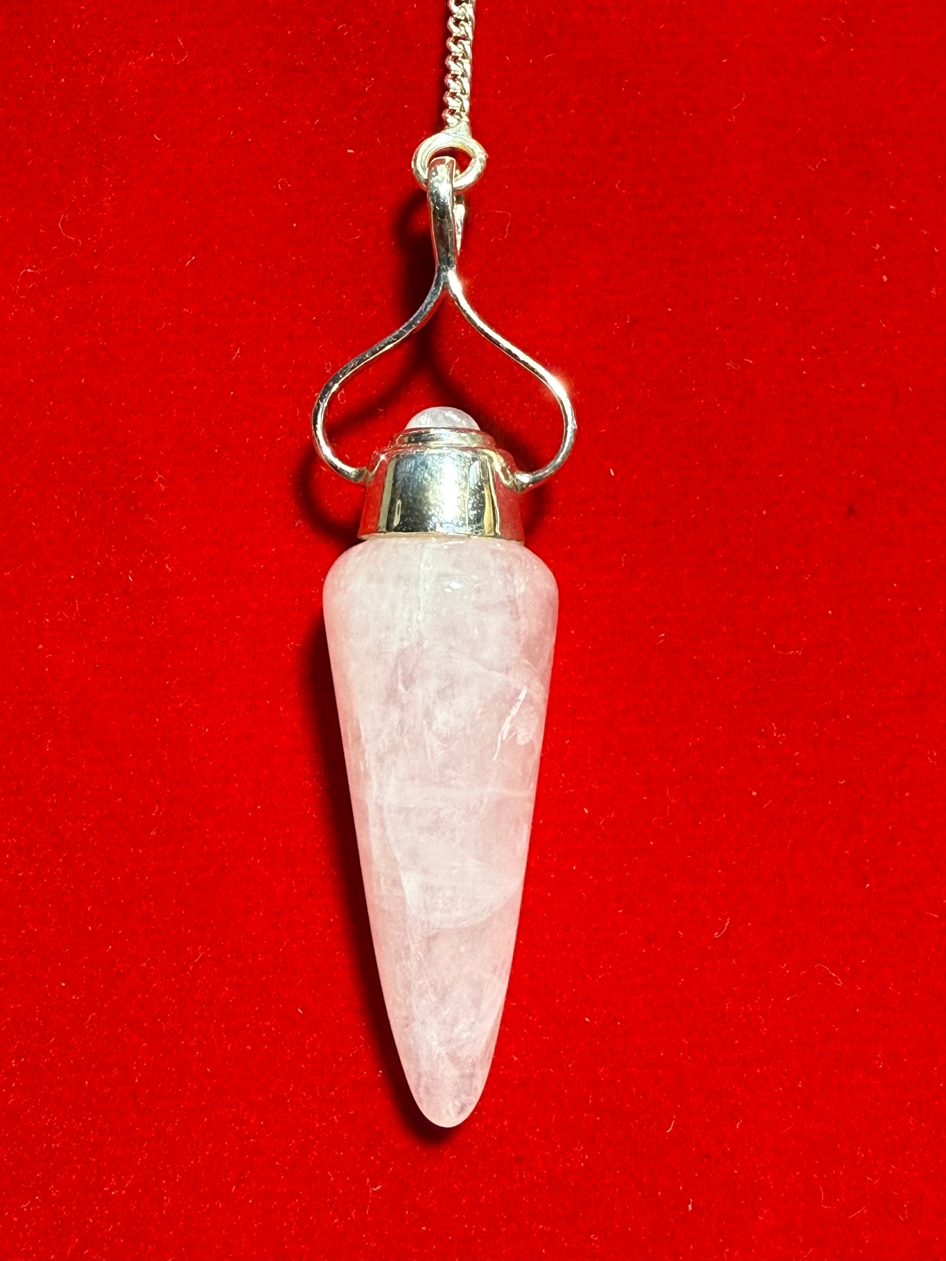 Rose Quartz and Rainbow Moonstone Sterling Silver Pendulum – elegant divination tool combining loving rose quartz and iridescent rainbow moonstone crystals.
