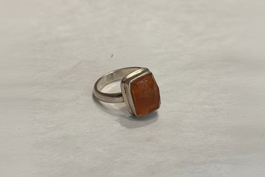 Sunstone Sterling Silver Ring size 5 – radiant orange crystal jewelry symbolizing vitality, energy, and joy.
