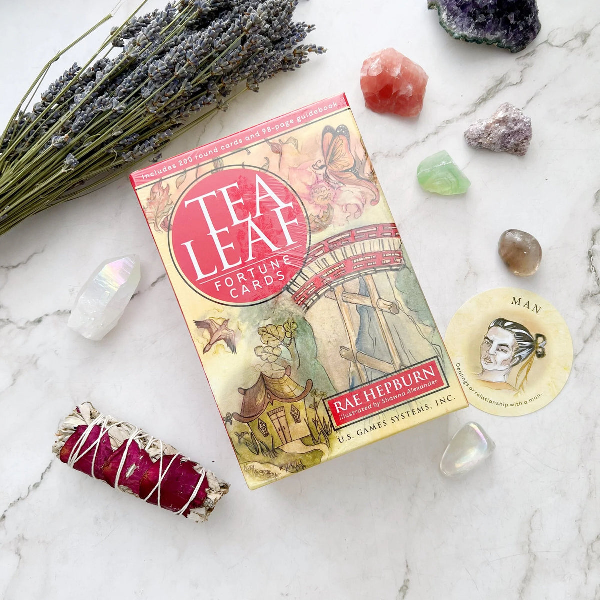 Tea Leaf Fortune Cards by Rae Hepburn – 200 round divination cards featuring traditional tea leaf symbols, accompanied by a 98-page illustrated guidebook for tasseomancy.

