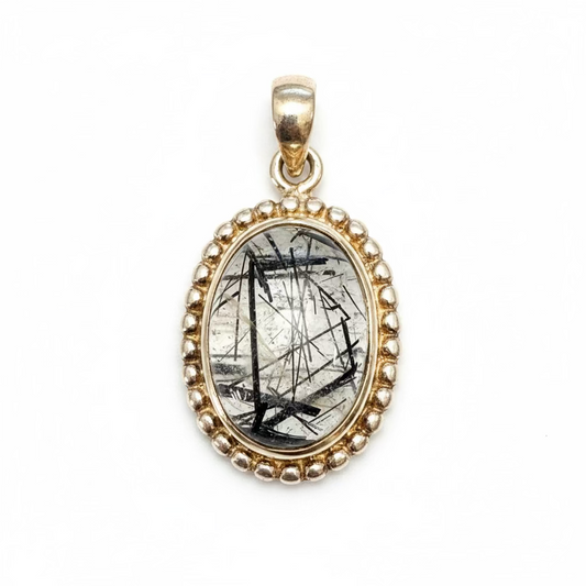 Tourmaline in Quartz Sterling Silver Pendant – unique crystal jewelry combining protective tourmaline within clear quartz for grounding and clarity.
