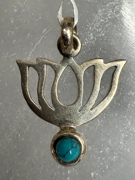 Turquoise Lotus Sterling Silver Pendant – elegant silver jewelry featuring turquoise stone and lotus design symbolizing healing and spiritual growth.
