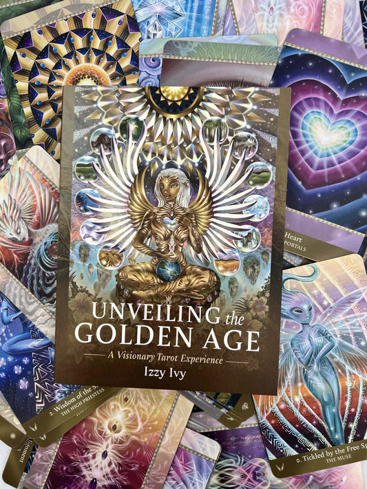 Unveiling the Golden Age Tarot by Izzy Ivy – 78-card deck featuring Lemurian-inspired artwork, satin gold edges, and a 304-page illustrated guidebook, blending tarot archetypes with oracle elements for transformative spiritual exploration.
