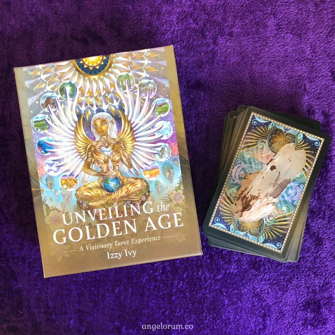 Unveiling the Golden Age Tarot by Izzy Ivy – 78-card deck featuring Lemurian-inspired artwork with satin gold edges, accompanied by a 304-page illustrated guidebook, housed in a deluxe box.
