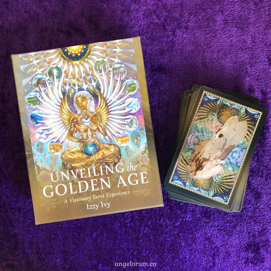 Unveiling the Golden Age Tarot by Izzy Ivy – 78-card deck featuring Lemurian-inspired artwork with satin gold edges, accompanied by a 304-page illustrated guidebook, housed in a deluxe box.
