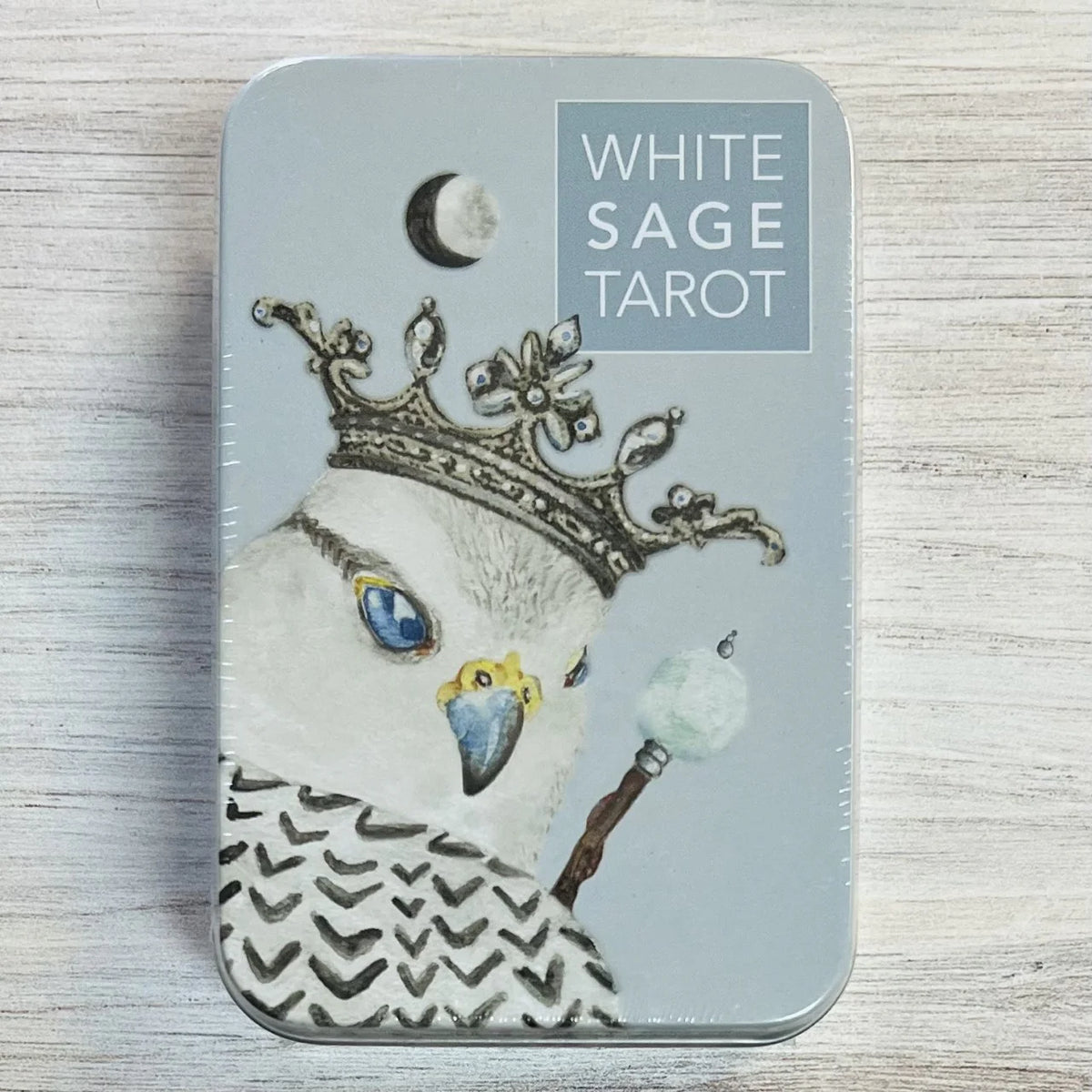 White Sage Tarot in a Tin by Theresa Hutch – 78-pocket-sized cards featuring endearing animals in the Court Cards, chakra colors in the Minors, and natural elements throughout, housed in a compact tin with a 64-page booklet and chakra chart.
