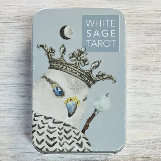 White Sage Tarot in a Tin by Theresa Hutch – 78-pocket-sized cards featuring endearing animals in the Court Cards, chakra colors in the Minors, and natural elements throughout, housed in a compact tin with a 64-page booklet and chakra chart.
