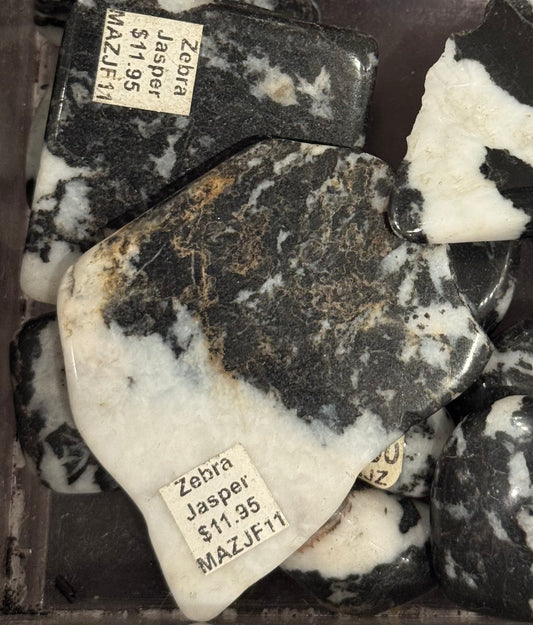 Zebra Jasper Crystal – natural zebra jasper known for its distinctive black and white striped patterns, ideal for balance and grounding.
