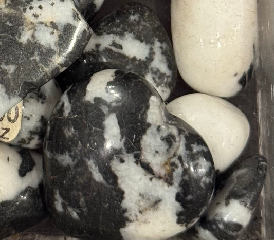 Zebra Jasper Tumbled Crystal – polished jasper stones with black and white stripes, perfect for balance and grounding.
