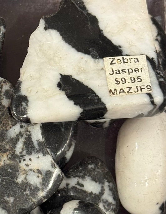 Zebra Jasper Tumbled Crystal – polished jasper stones with striking black and white stripes, perfect for grounding and balance.
